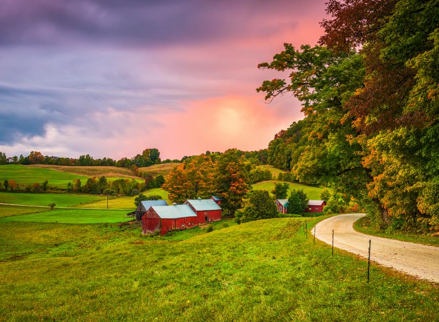 Country side with a red barn in the distance