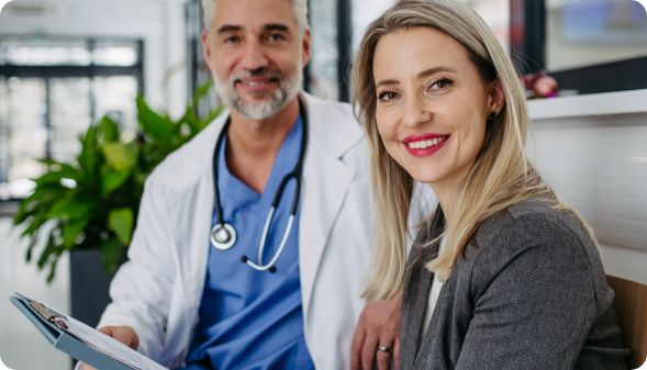 Doctor sitting with patient